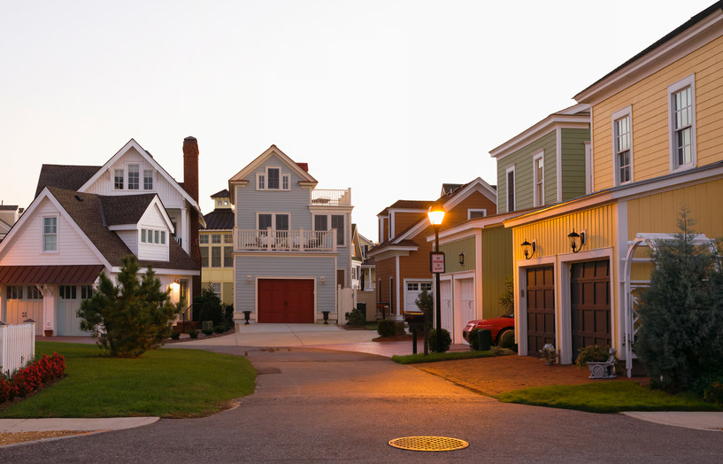 Colorful suburban houses along a quiet residential street in Virginia.
